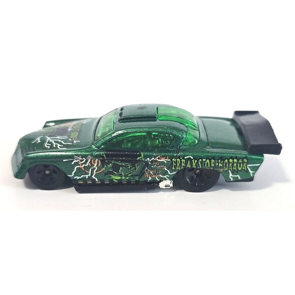 Hot Wheels 1998 Freaks of Horror At-A-Tude Green Metalflake with Graphics 1:64 - Picture 1 of 6